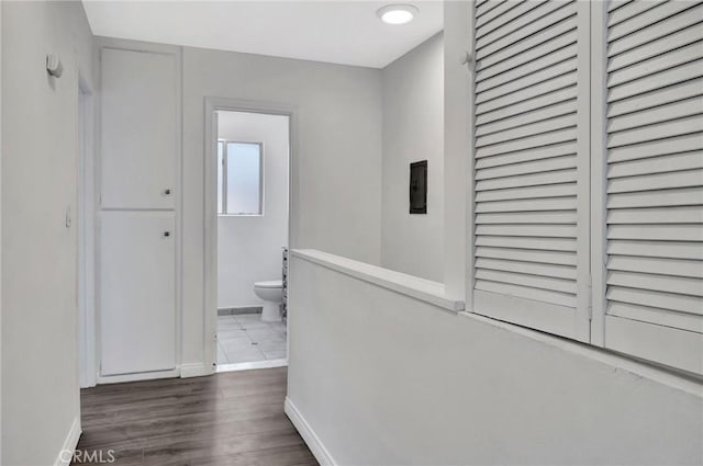 17053 Roscoe Blvd Unit 3, Northridge, CA 91325 - corridor with baseboards, wood finished floors, and electric panel