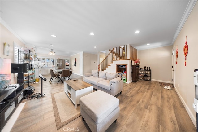 6252 Verdugo Ave, Chino, CA 91710 - living area with ornamental molding, stairway, light wood finished floors, recessed lighting, and baseboards