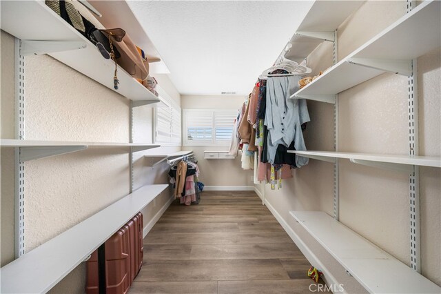 6252 Verdugo Ave, Chino, CA 91710 - walk in closet featuring wood finished floors