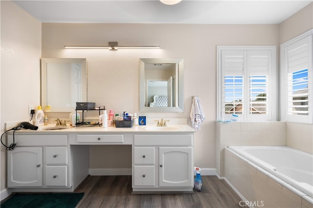 6252 Verdugo Ave, Chino, CA 91710 - full bath featuring wood finished floors, a bath, and double vanity
