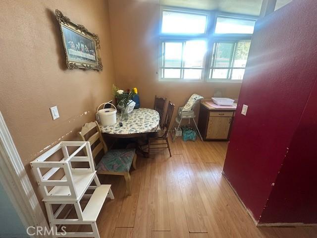 1815 W 9th St, Pomona, CA 91766 - dining room featuring light wood finished floors