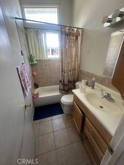 1815 W 9th St, Pomona, CA 91766 - full bath featuring tile patterned floors, vanity, toilet, and shower / tub combo with curtain