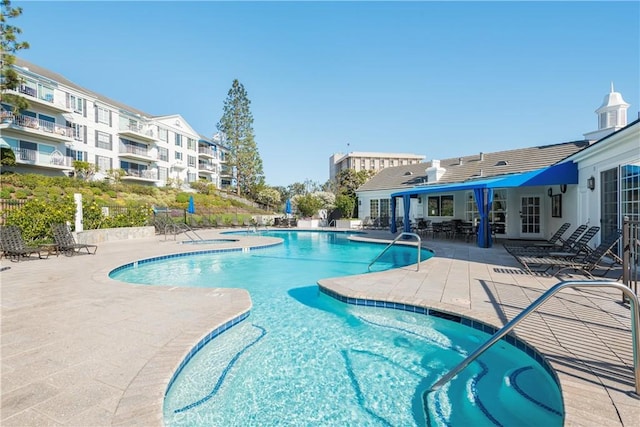 270 Cagney Ln Unit 215, Newport Beach, CA 92663 - community pool with a patio, fence, and french doors