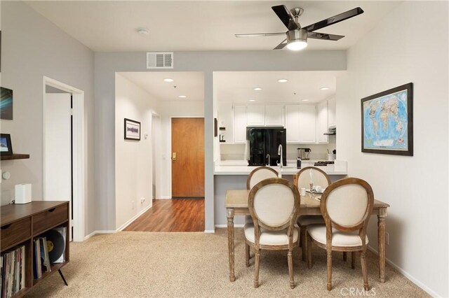 270 Cagney Ln Unit 215, Newport Beach, CA 92663 - dining room with light colored carpet, a ceiling fan, baseboards, and recessed lighting