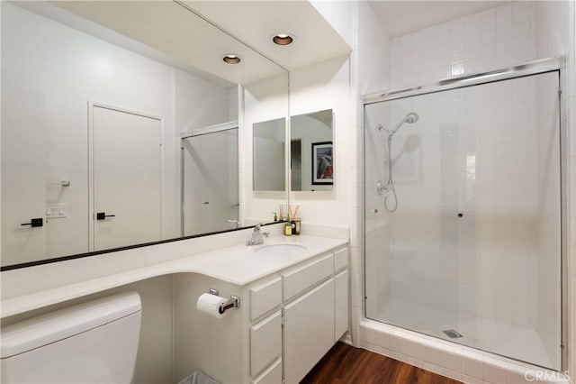270 Cagney Ln Unit 215, Newport Beach, CA 92663 - full bath with a stall shower, toilet, wood finished floors, vanity, and recessed lighting