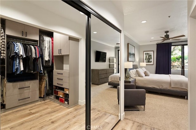 270 Cagney Ln Unit 215, Newport Beach, CA 92663 - bedroom featuring ornamental molding, light wood finished floors, recessed lighting, and a closet