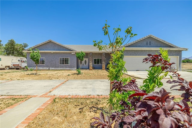 38740 25th St E, Palmdale, CA 93550 - single story home with an attached garage, stucco siding, and concrete driveway