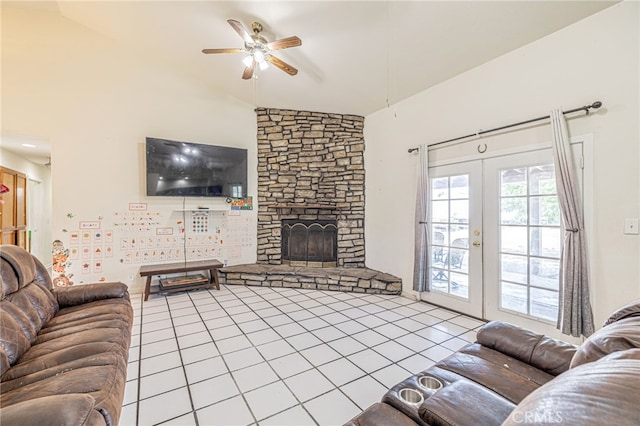 38740 25th St E, Palmdale, CA 93550 - tiled living area with lofted ceiling, french doors, ceiling fan, and a stone fireplace