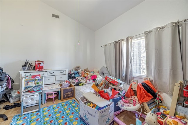 38740 25th St E, Palmdale, CA 93550 - playroom with vaulted ceiling and wood finished floors