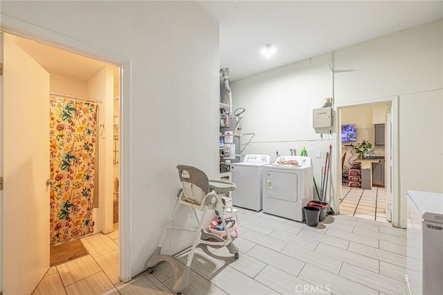 38740 25th St E, Palmdale, CA 93550 - laundry room featuring washer and clothes dryer and gas water heater