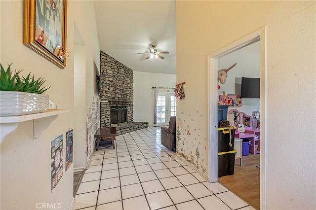 38740 25th St E, Palmdale, CA 93550 - living room with a ceiling fan, a fireplace, and light tile patterned floors