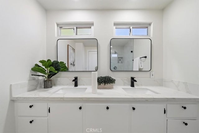 18710 Corwin Rd, Apple Valley, CA 92307 - full bathroom featuring double vanity, healthy amount of natural light, and a shower with shower door