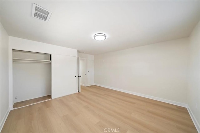 18710 Corwin Rd, Apple Valley, CA 92307 - unfurnished bedroom with light wood finished floors, a closet, and baseboards