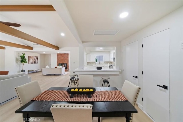 18710 Corwin Rd, Apple Valley, CA 92307 - dining space with light wood-style floors, recessed lighting, and beamed ceiling