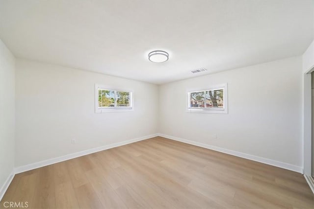 18710 Corwin Rd, Apple Valley, CA 92307 - unfurnished room featuring light wood finished floors and baseboards