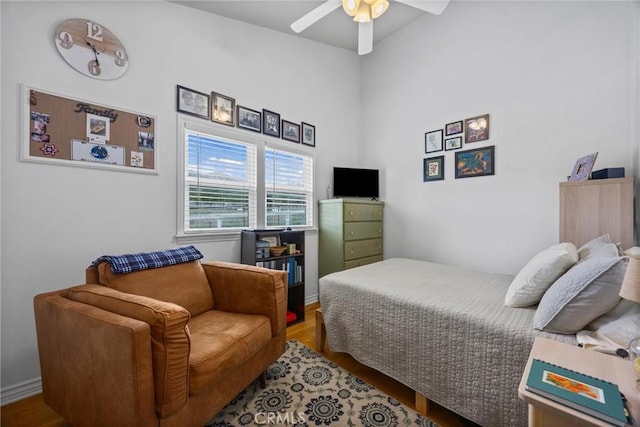 bedroom with ceiling fan and wood finished floors