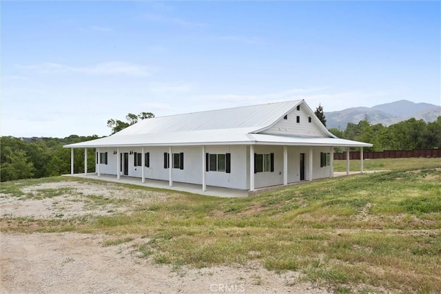 view of property exterior with a mountain view and stucco siding