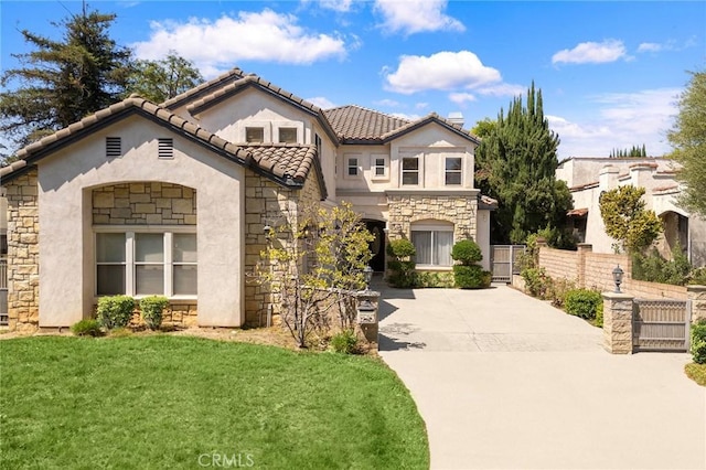 159 N San Marino Ave, San Gabriel, CA 91775 - mediterranean / spanish home featuring stone siding, stucco siding, a tile roof, and driveway