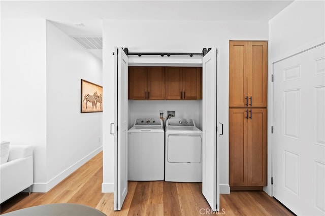 160 S Altadena Dr, Pasadena, CA 91107 - washroom with cabinet space, separate washer and dryer, light wood finished floors, and baseboards
