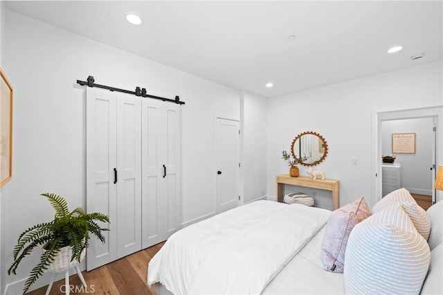 160 S Altadena Dr, Pasadena, CA 91107 - bedroom with wood finished floors, a barn door, and recessed lighting