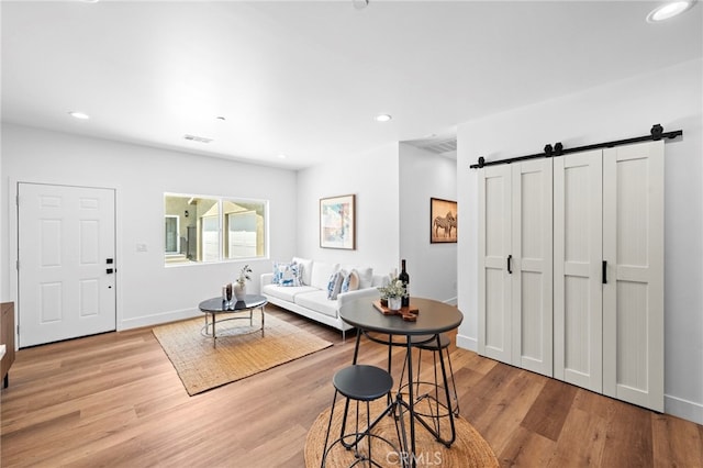 160 S Altadena Dr, Pasadena, CA 91107 - living area featuring a barn door, light wood-style flooring, recessed lighting, and baseboards