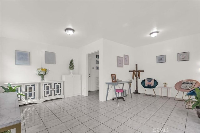 sitting room with light tile patterned floors