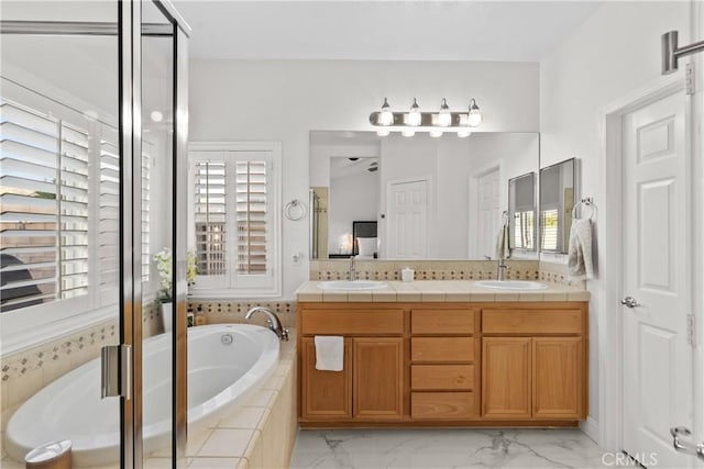 4064 Prestwick Ln, Palmdale, CA 93551 - bathroom with plenty of natural light, double vanity, a bath, and marble look tiles