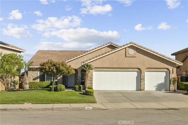 4064 Prestwick Ln, Palmdale, CA 93551 - mediterranean / spanish-style home with stone siding, an attached garage, driveway, and stucco siding
