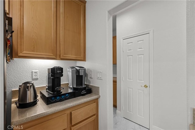 4064 Prestwick Ln, Palmdale, CA 93551 - kitchen with light marble finish flooring, baseboards, light countertops, and a textured wall