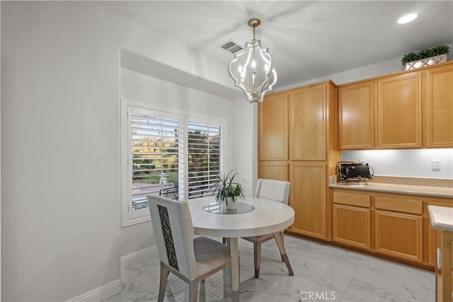 4064 Prestwick Ln, Palmdale, CA 93551 - dining room with light marble finish flooring and a chandelier