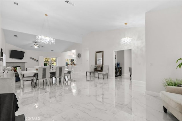 4064 Prestwick Ln, Palmdale, CA 93551 - dining area with a chandelier, ceiling fan, vaulted ceiling, light marble finish floors, and baseboards