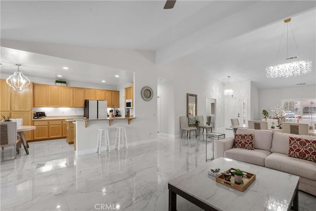 4064 Prestwick Ln, Palmdale, CA 93551 - living area featuring a chandelier, light marble finish floors, lofted ceiling, recessed lighting, and baseboards