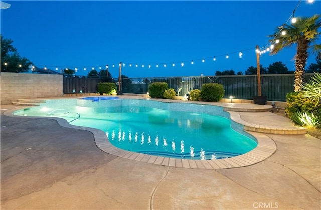 4064 Prestwick Ln, Palmdale, CA 93551 - pool at twilight featuring a fenced backyard and a patio area