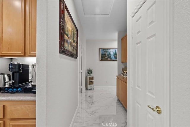 4064 Prestwick Ln, Palmdale, CA 93551 - hall featuring light marble finish floors, baseboards, and attic access