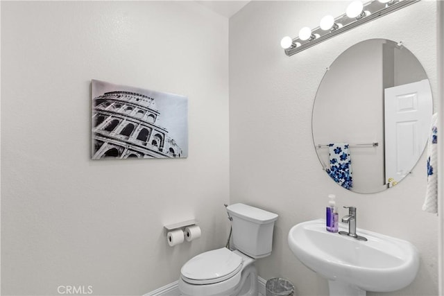 4064 Prestwick Ln, Palmdale, CA 93551 - half bath with a sink, toilet, and baseboards