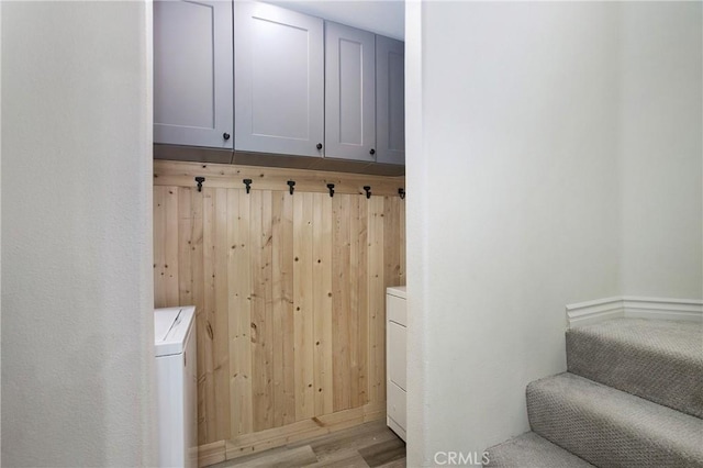 11 Via Pamplona, Rancho Santa Margarita, CA 92688 - laundry room with washer / clothes dryer, wooden walls, and light wood-type flooring