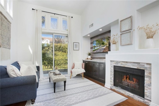11 Via Pamplona, Rancho Santa Margarita, CA 92688 - living room with wood finished floors, a towering ceiling, and a fireplace