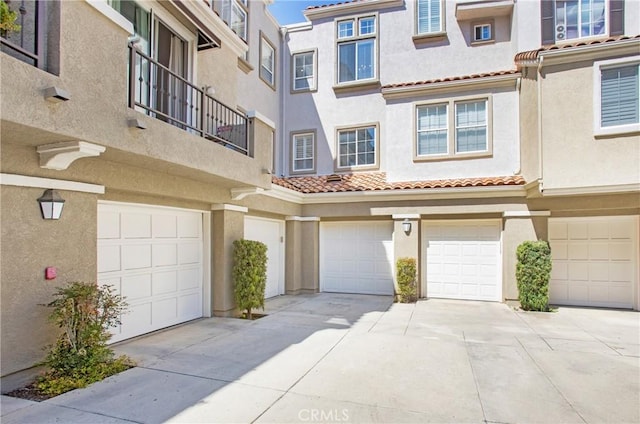 11 Via Pamplona, Rancho Santa Margarita, CA 92688 - view of property with an attached garage, driveway, stucco siding, and a tiled roof