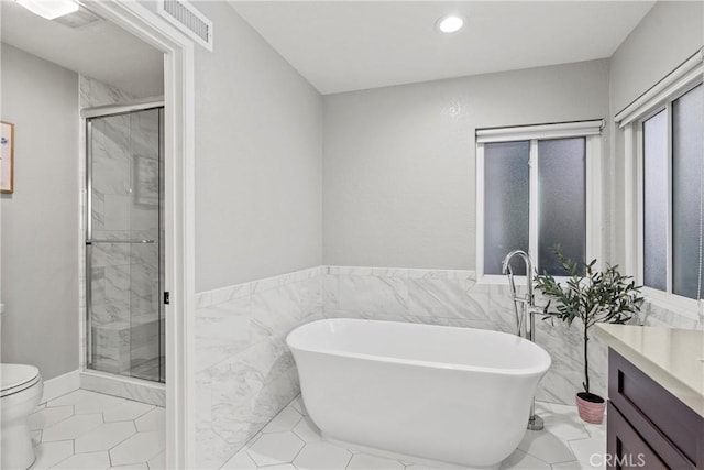 30 Yorktown, Irvine, CA 92620 - bathroom featuring vanity, a shower stall, toilet, a freestanding tub, and recessed lighting
