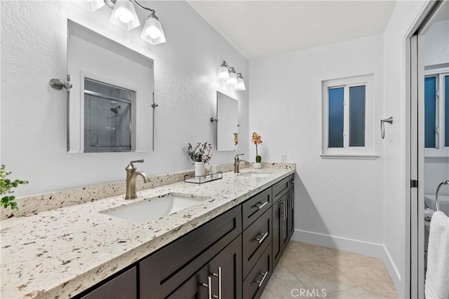 30 Yorktown, Irvine, CA 92620 - full bath with tile patterned flooring, double vanity, baseboards, and a shower