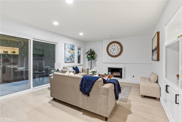 30 Yorktown, Irvine, CA 92620 - living area featuring a brick fireplace, light wood-style floors, and recessed lighting