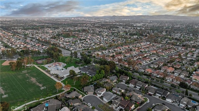 30 Yorktown, Irvine, CA 92620 - aerial overview of property's location with a mountain backdrop and nearby suburban area