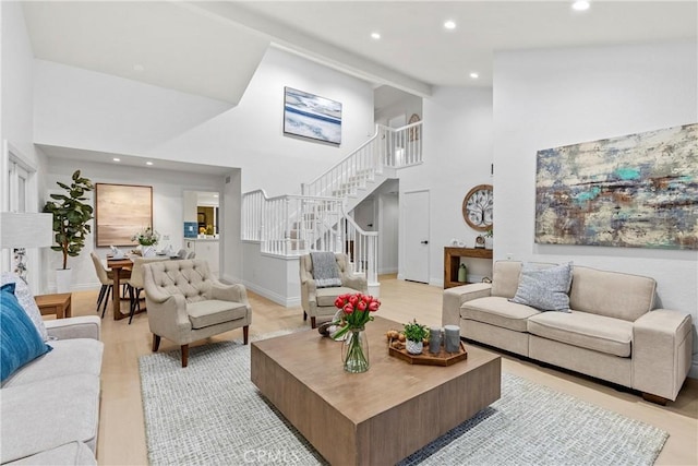 30 Yorktown, Irvine, CA 92620 - living room featuring high vaulted ceiling, stairs, recessed lighting, and light wood-type flooring