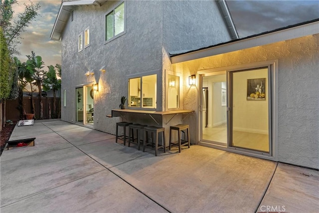 30 Yorktown, Irvine, CA 92620 - rear view of property with stucco siding, a patio, and fence