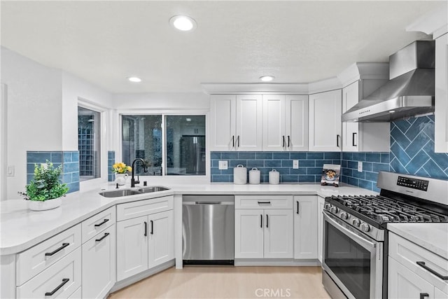 30 Yorktown, Irvine, CA 92620 - kitchen featuring appliances with stainless steel finishes, wall chimney range hood, a sink, light countertops, and backsplash