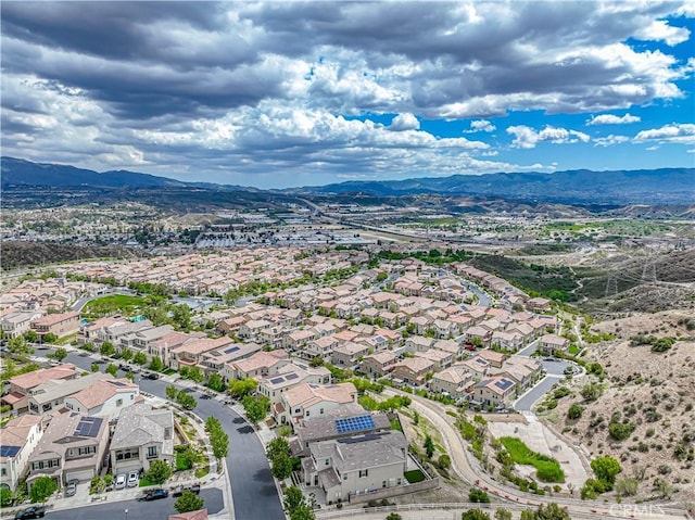aerial view of residential area with mountains