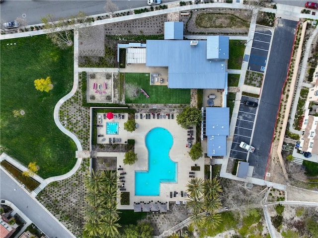 view of property location with a pool