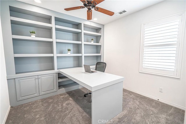 unfurnished office with carpet flooring, a ceiling fan, baseboards, and recessed lighting