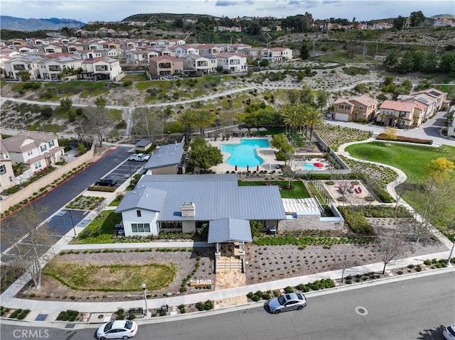 aerial view of residential area featuring a pool area and mountains