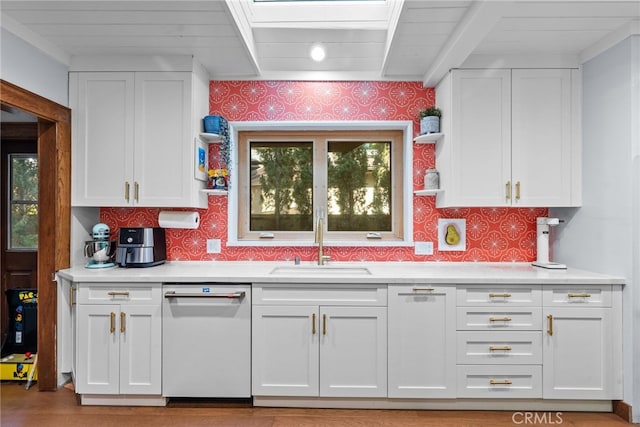 1719 Monte Vista St, Pasadena, CA 91106 - kitchen with dishwasher, a sink, white cabinets, light countertops, and wallpapered walls
